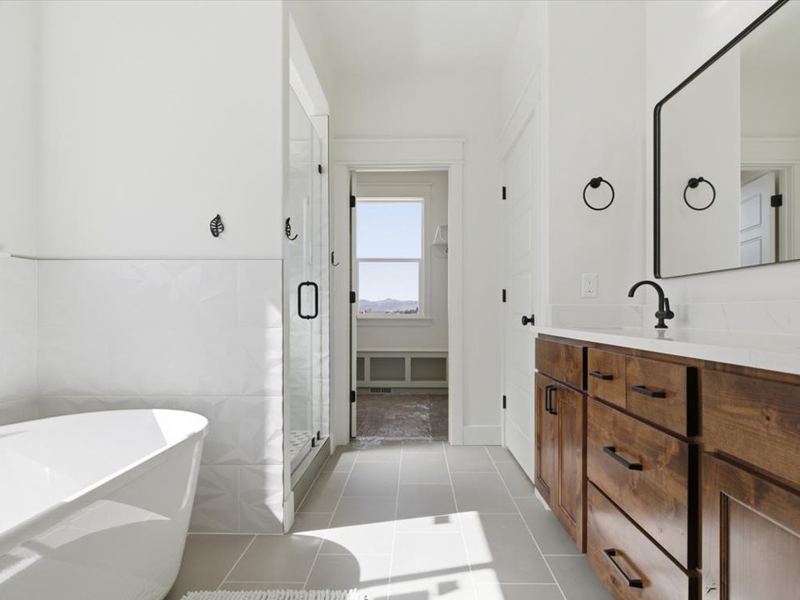Freestanding soaking tub in the primary bath