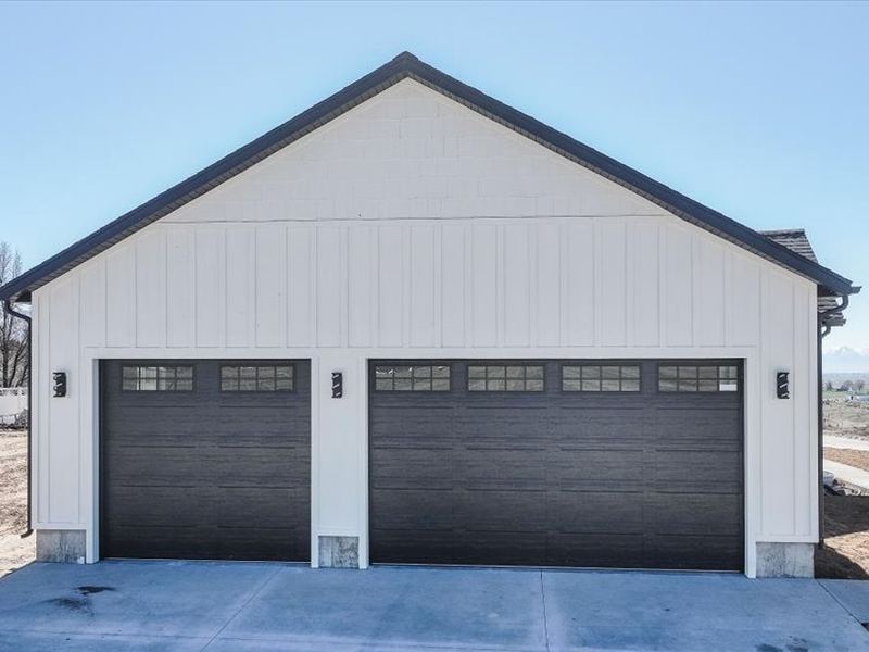 Three-car garage with board-and-batten siding