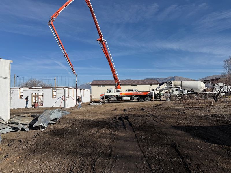 Pump truck filling ICF walls with concrete