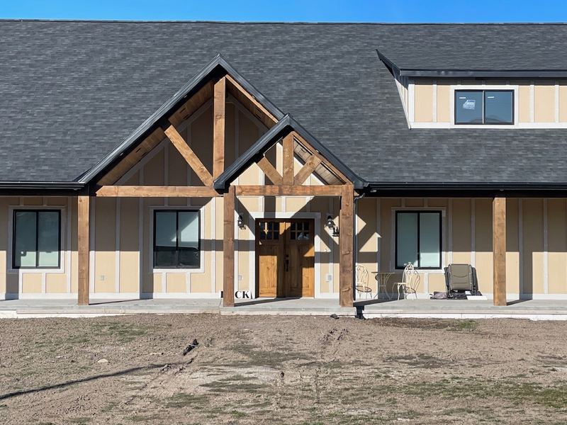 Silver Spurs custom home with a timber-frame entry