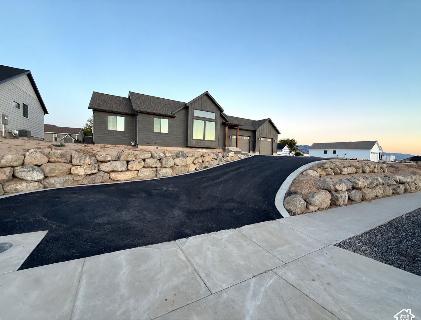 Rock retaining walls and paved driveway at 832 S 1100 E, Preston, Idaho