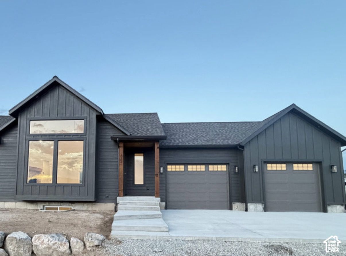 Front exterior and two-car garage of 832 S 1100 E, Preston, Idaho