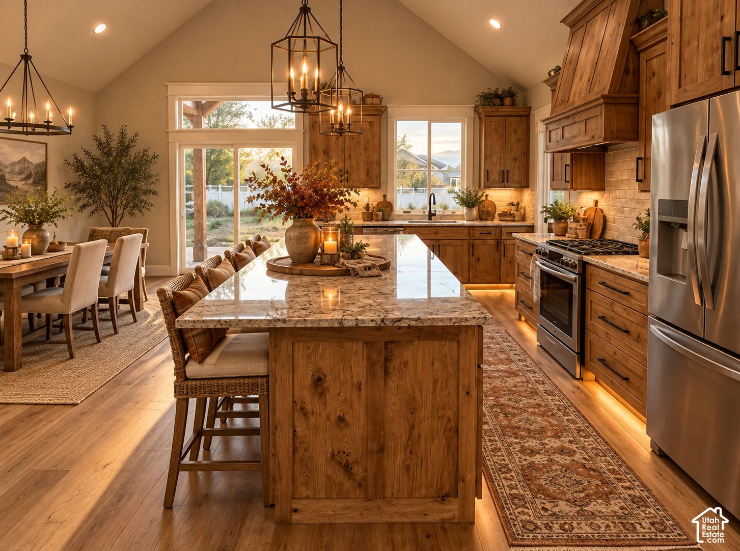 Kitchen at 832 S 1100 E with a granite-topped wood island, stainless appliances, and pendant lights